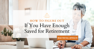 woman with gray hair sitting at her desk with her laptop, coffee mug, and notebook