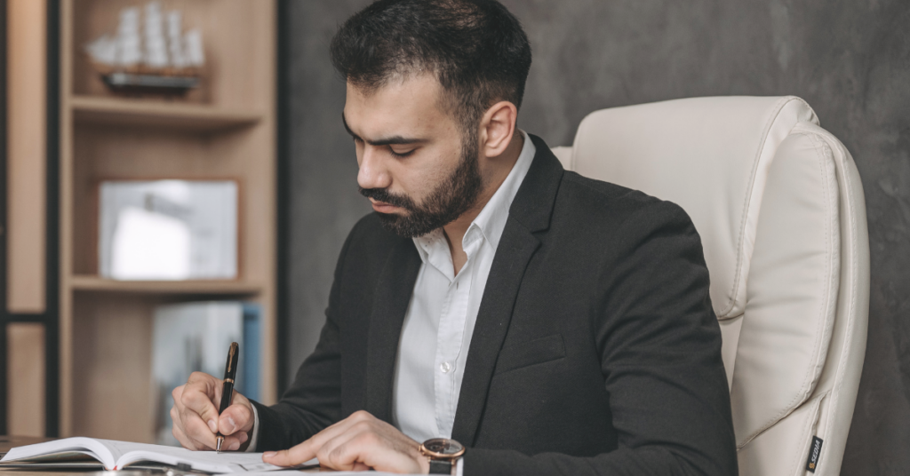 estate attorney at desk writing notes about financial planning for lawyers