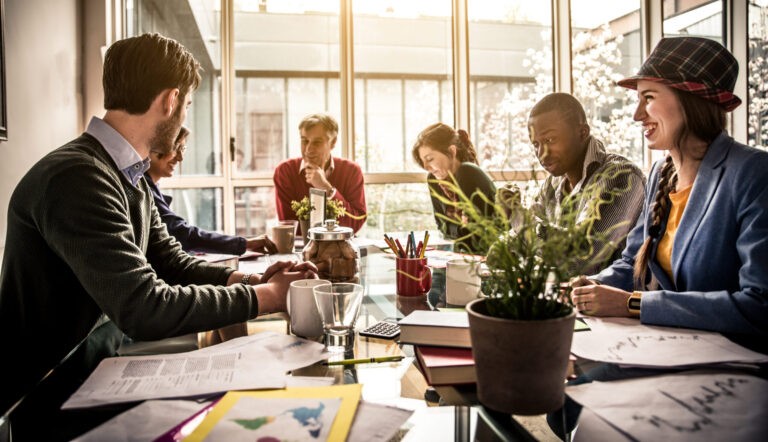 Team of creative business people discussing modern investments