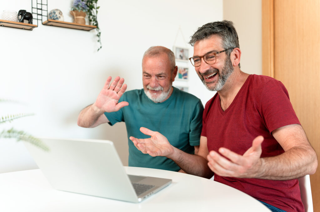 gay couple doing Financial Planning for LGBTQ+ Couples Over 50 virtually