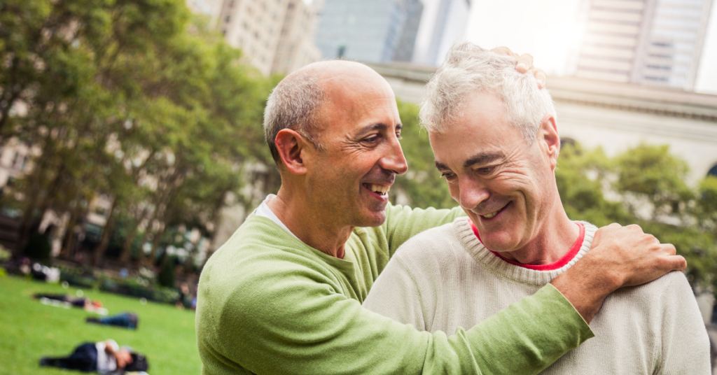 gay couple in their 50s discussing How to Switch Financial Advisors for high net worth individuals